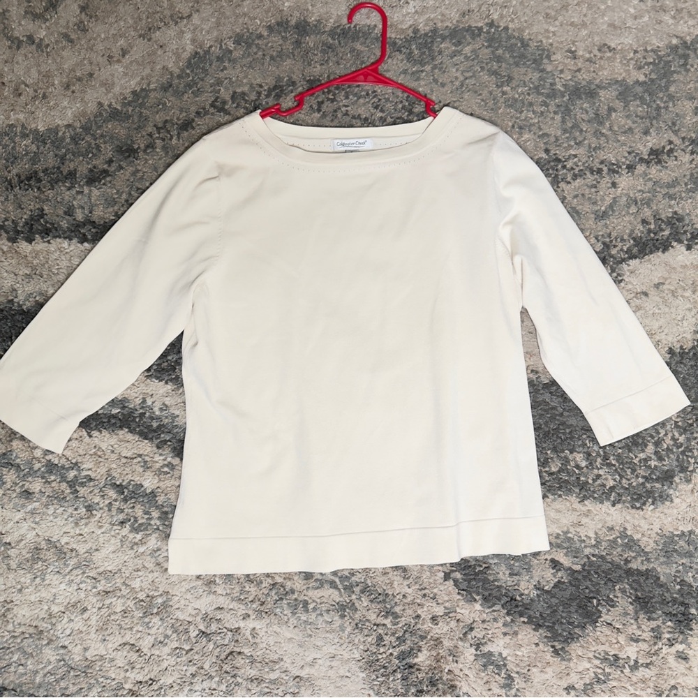Off White long sleeve shirt with a relaxed fit.